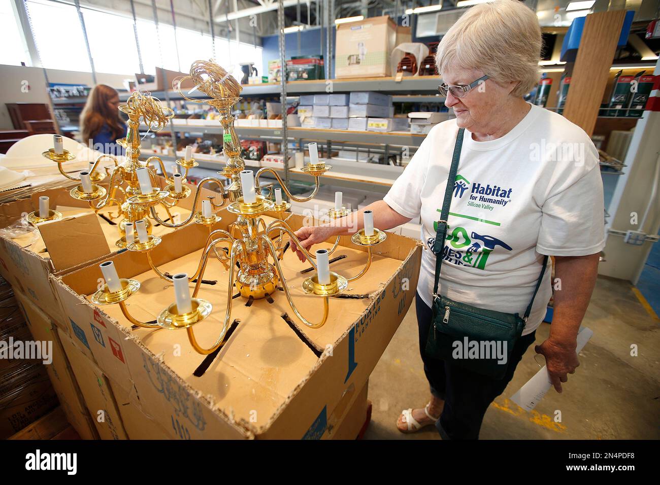 IMAGE DISTRIBUTED FOR HABITAT FOR HUMANITY A customer looks at some