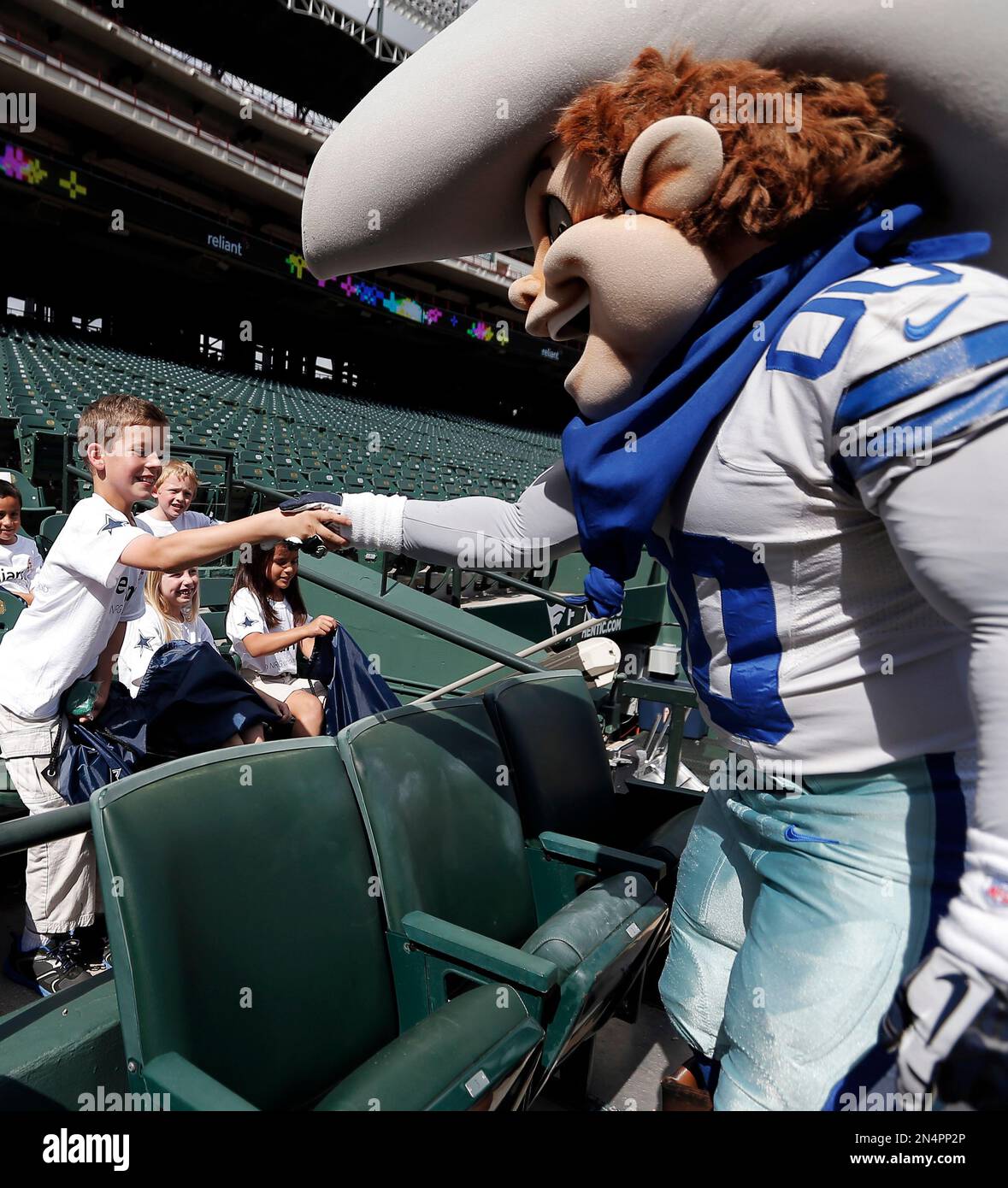 Dallas Cowboys mascot, Rowdy, shales hands with Konan Ortez, 10, during ...