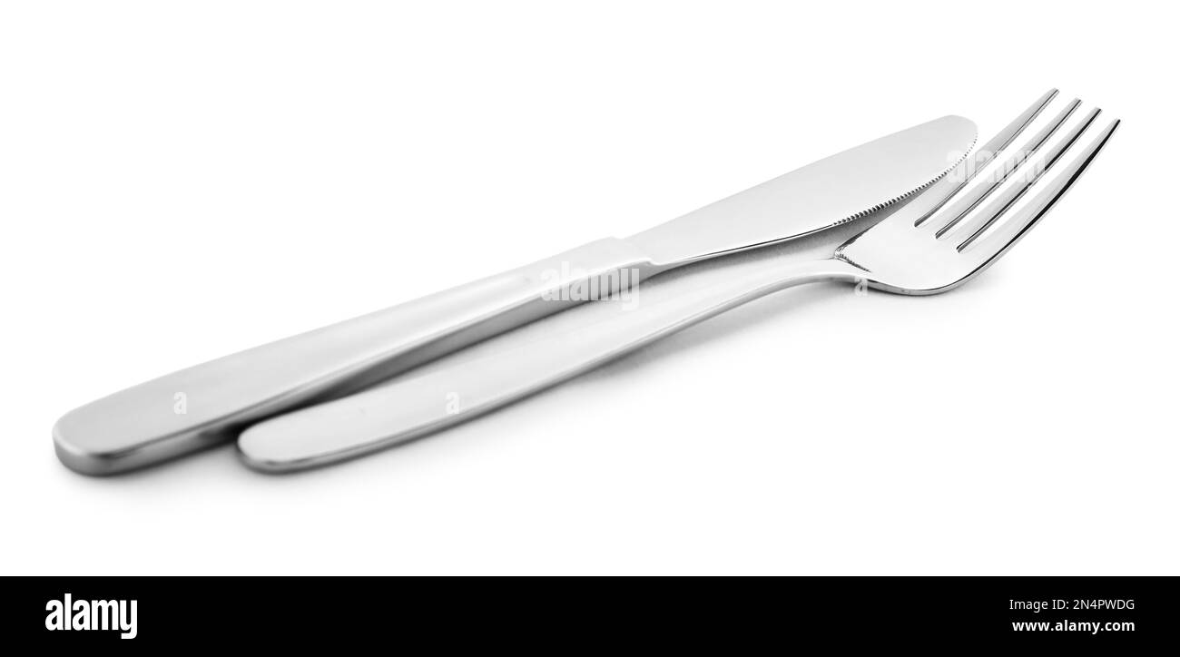 New clean shiny cutlery isolated on white Stock Photo Alamy