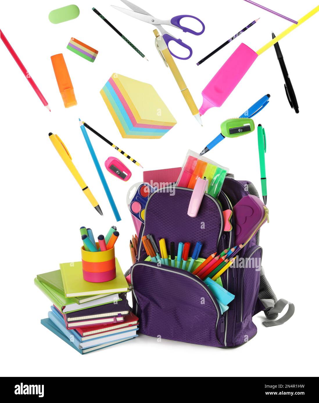 School stationery flying over backpack on white background Stock Photo