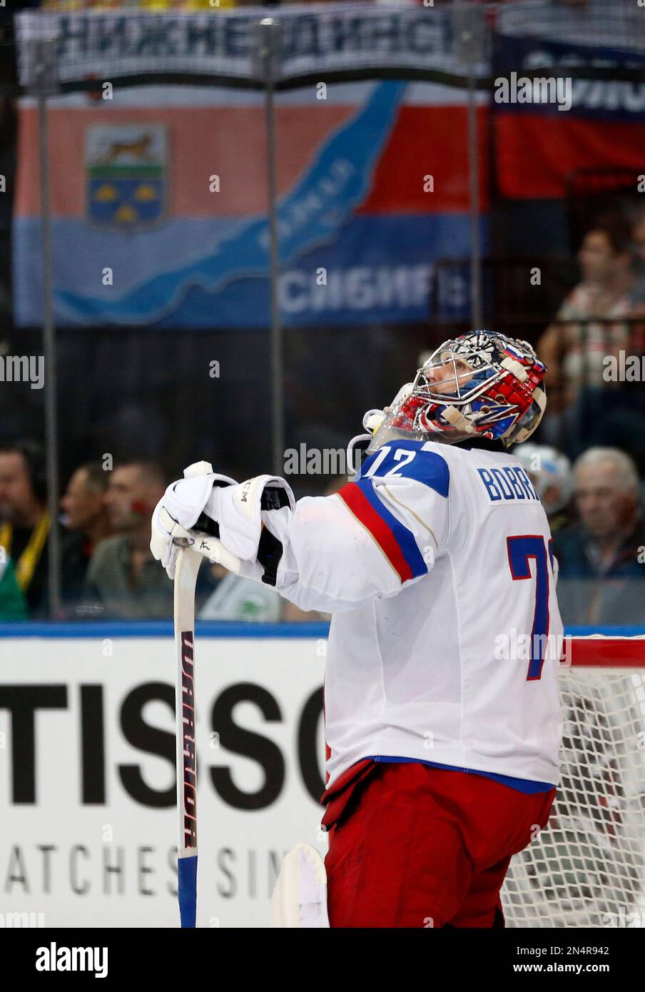 Russia goaltender Sergei Bobrovski looks at the scoreboard after giving
