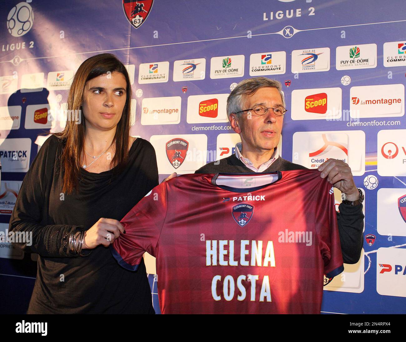 Clermont Ferrand's new coach Helena Costa of Portugal, left, and Clermont  President Claude Michy, right, hold the team's jersey during a press  conference to announce the Helena Costa's appointment in Clermont-Ferrand,  central