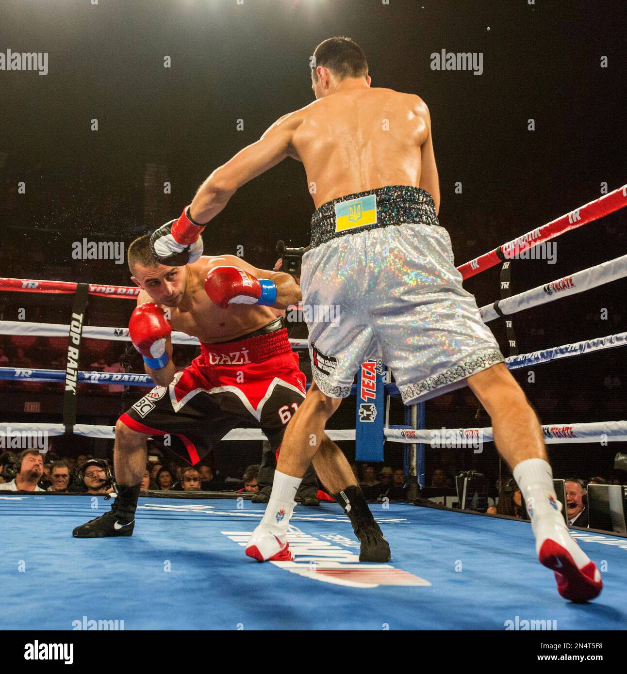 Selcuk Aydin, left, of Turkey and Viktor Postol, of Ukraine, exchange ...