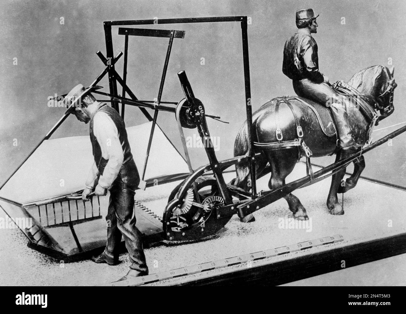 A scale size model of the first reaper is shown on Feb. 5, 1936. The