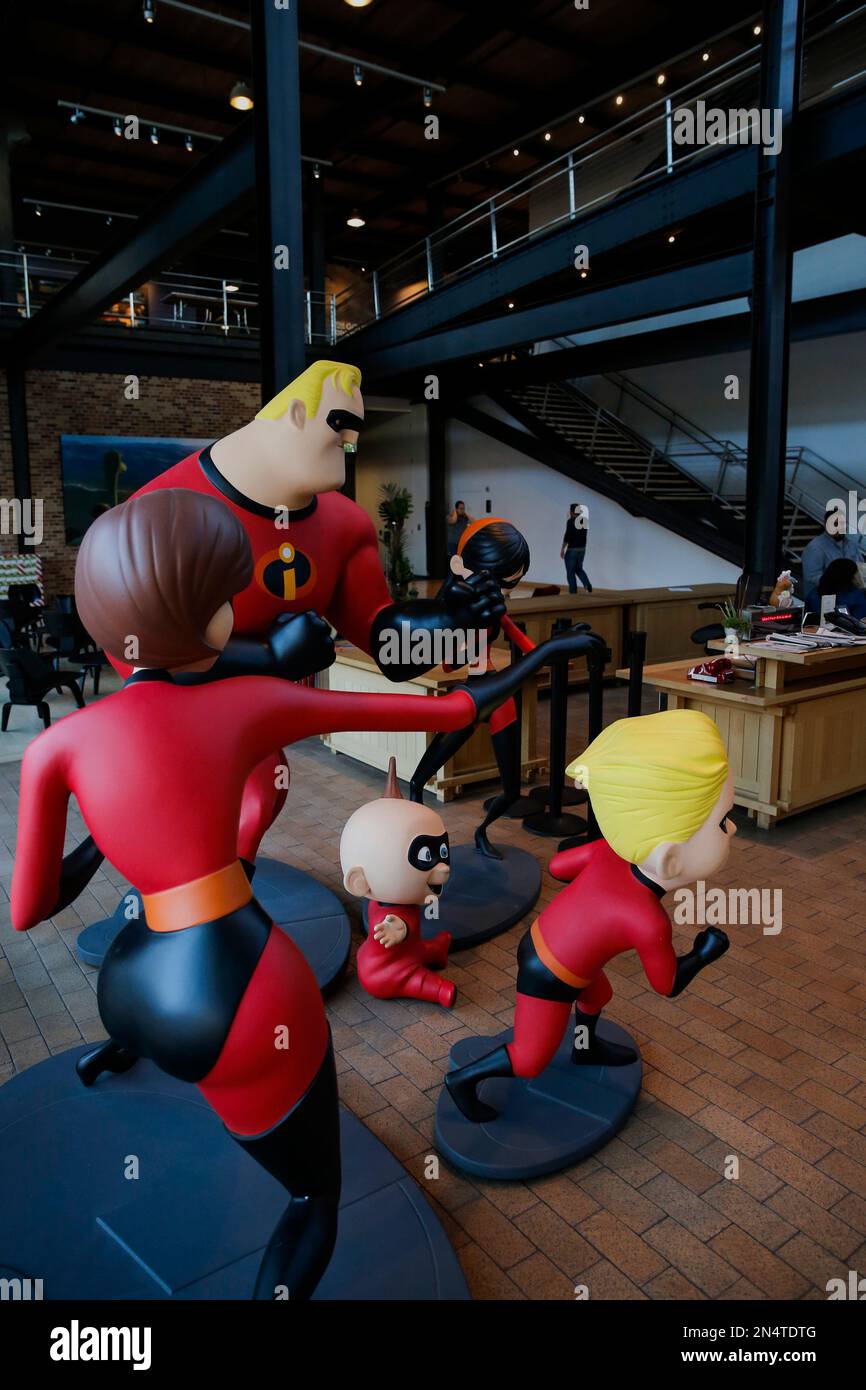 The Incredibles guard the entrance into the Steve Jobs building at the