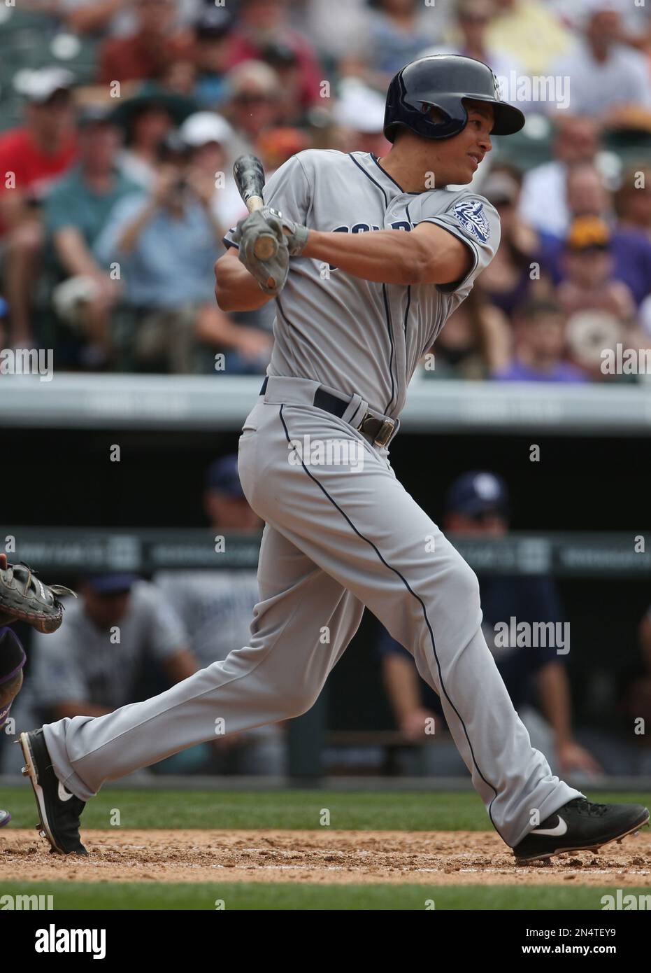 San Diego Padres' Cory Spangenberg follows the flight of his three-run home  run off Colorado Rockies starting pitcher Jon Gray in the sixth inning of a  baseball game Wednesday, July 19, 2017