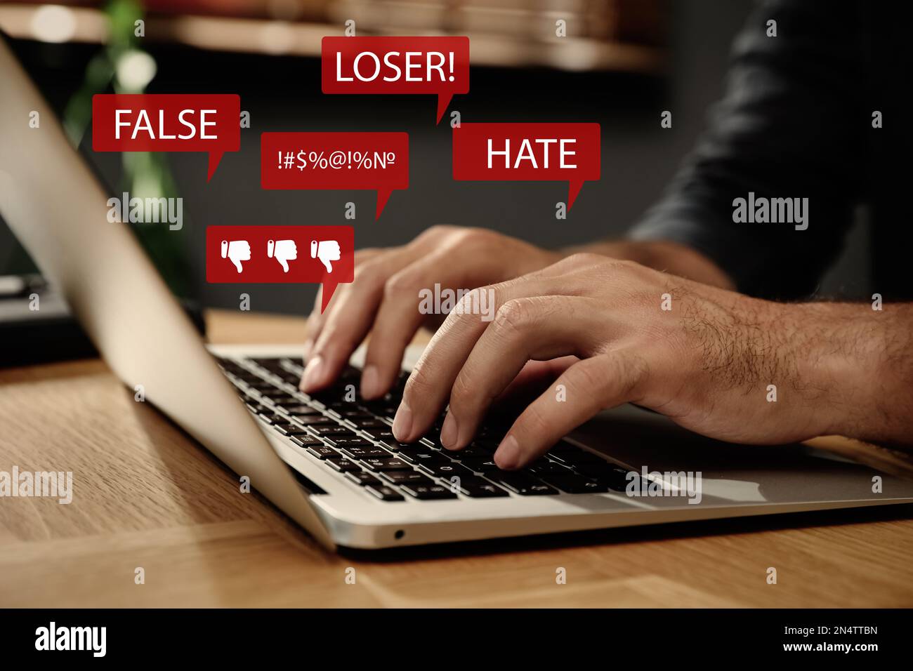Man using laptop and icons with offensive messages, closeup. Cyber ...