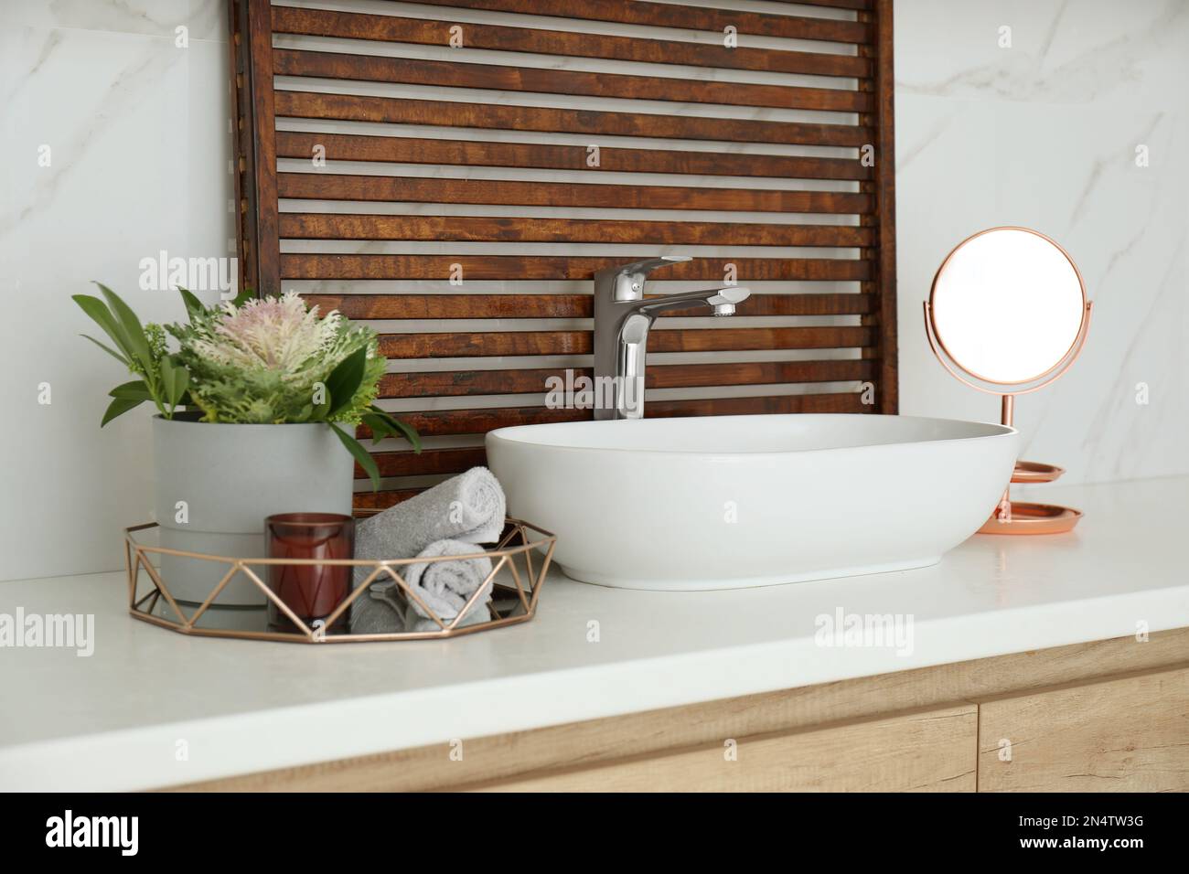 Bathroom counter with stylish vessel sink and small mirror. Interior design Stock Photo - Alamy
