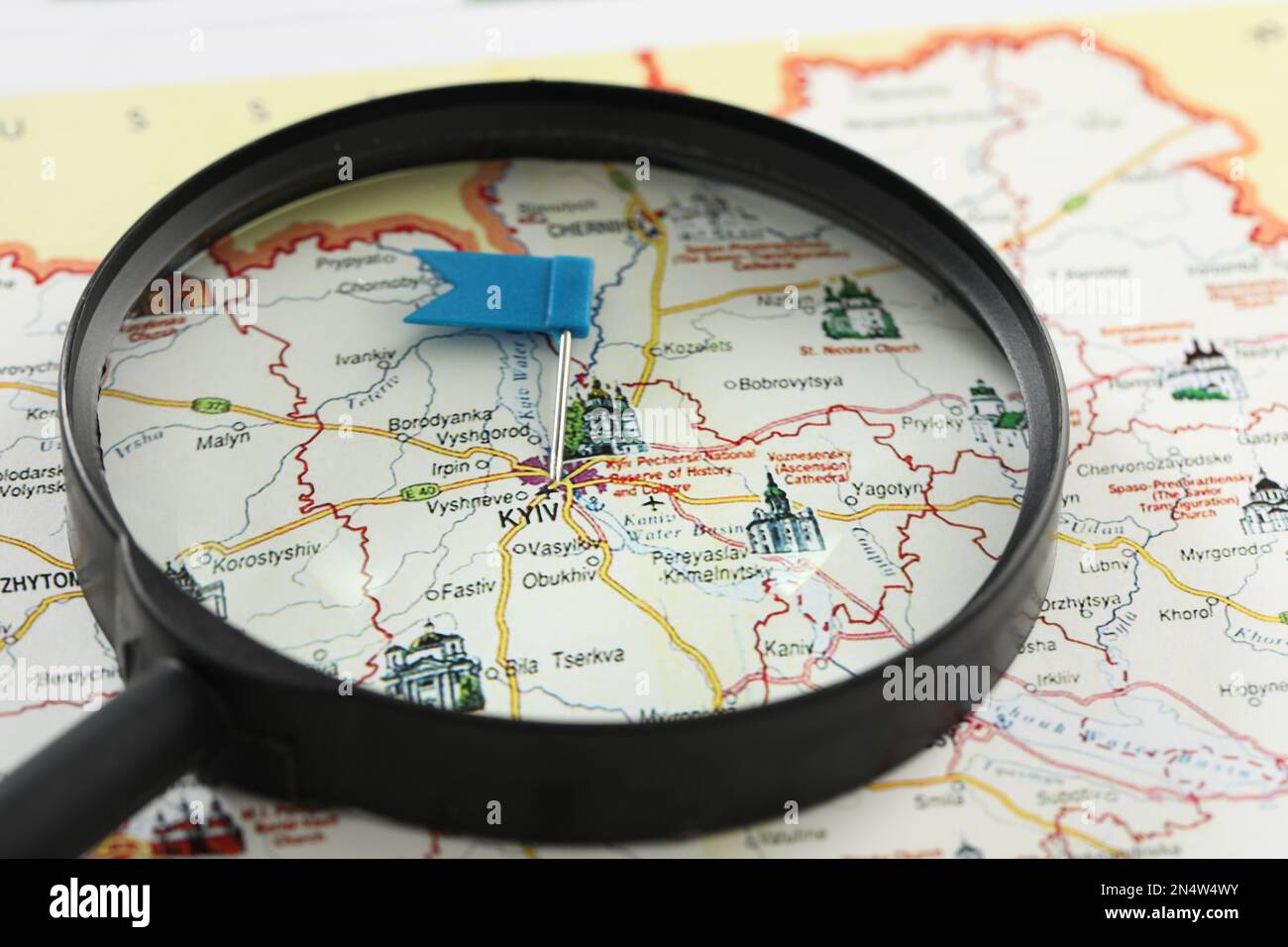 MYKOLAIV, UKRAINE - NOVEMBER 09, 2020: Magnifying glass on map of Ukraine with marked Kyiv city, closeup Stock Photo