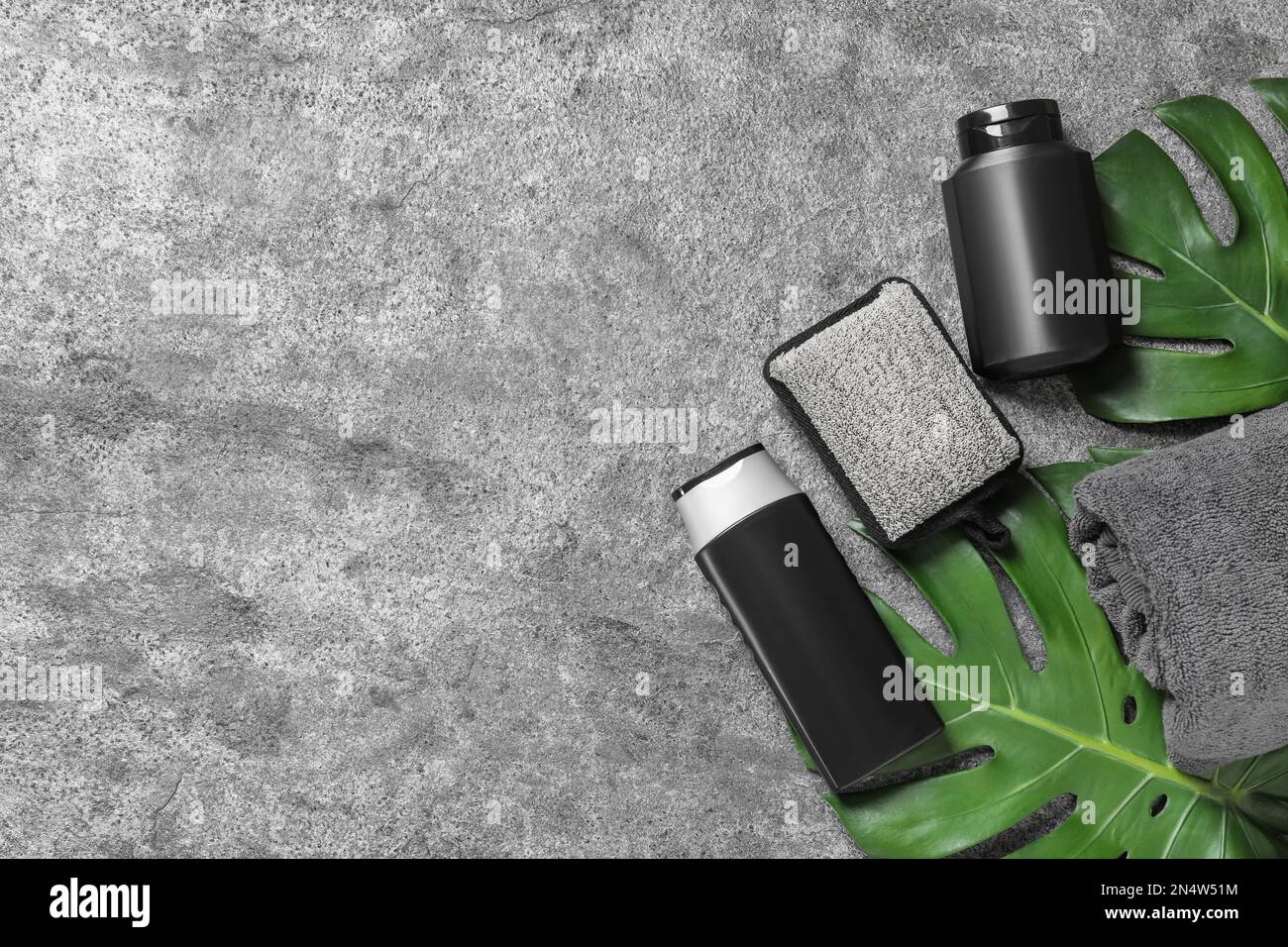 Flat lay composition with men's cosmetic products on grey background ...