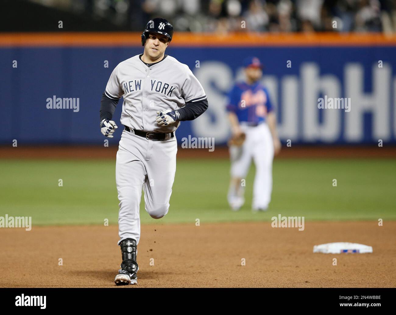 New York Yankees Mark Teixeira trots the bases after hitting a sixth