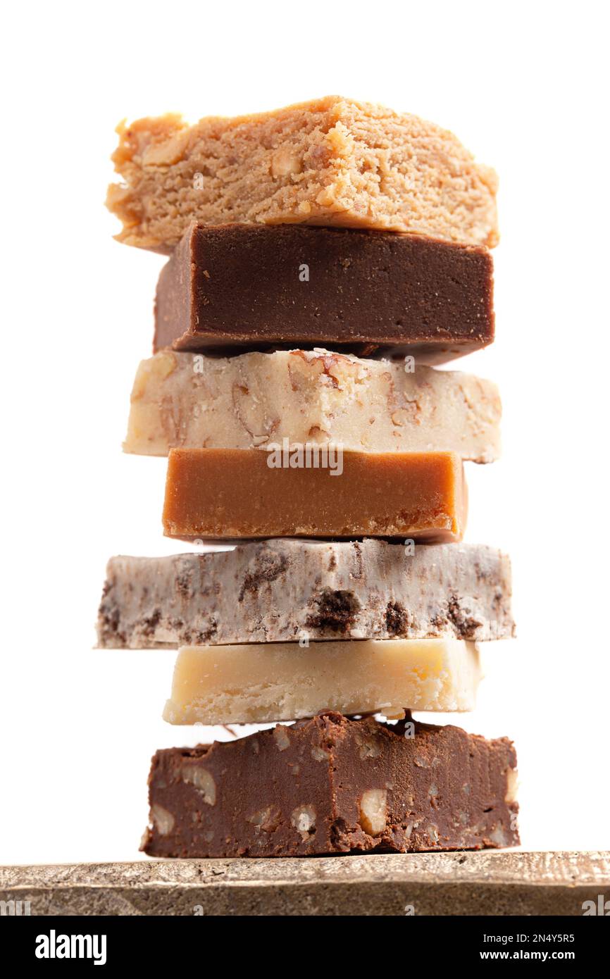 A Stack of Six Different Types of Fudge Isolated on a White Background