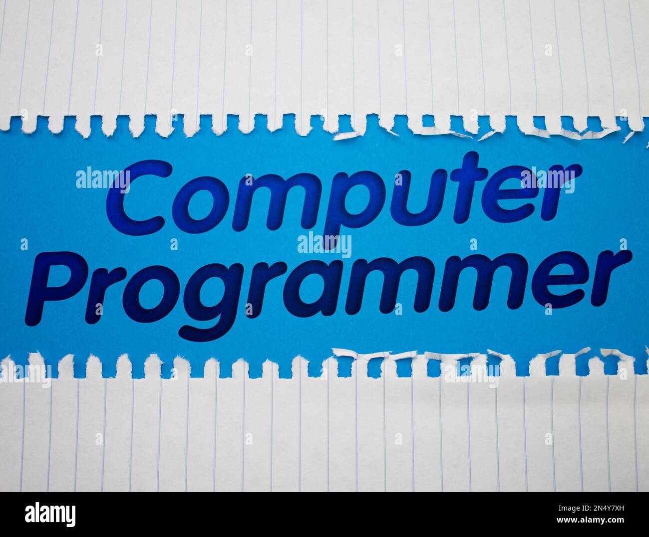 Computer Programmer text with Torn, Crumpled White Paper on colored ...