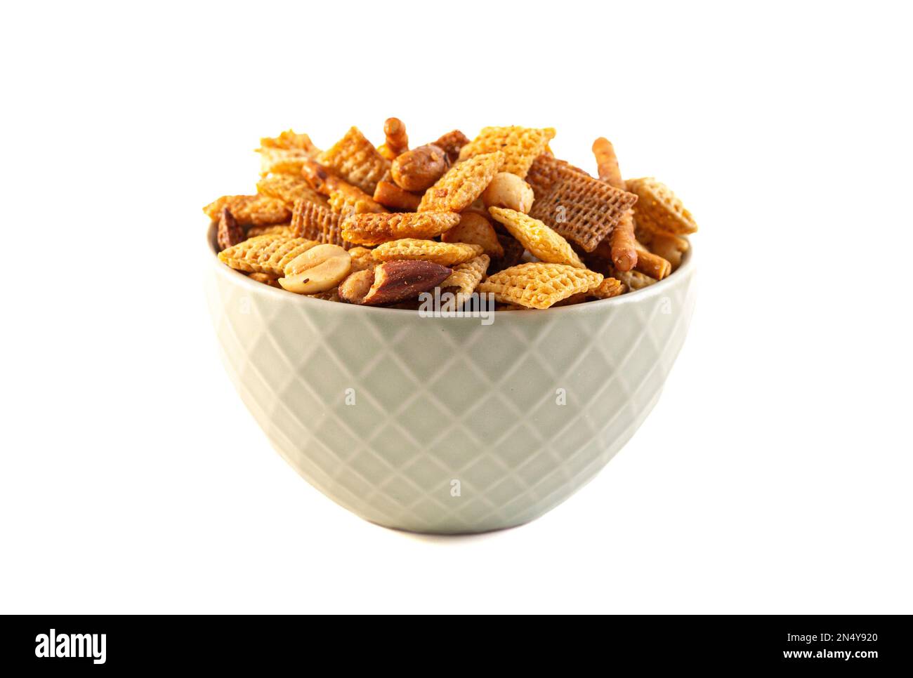 Serving of Homemade Cereal Nut and Prezel Trail Mix Isolated on a White