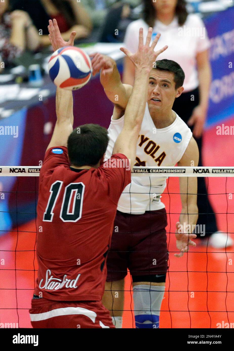 Loyola's Thomas Jaeschke, right, hits the ball against Stanford's Brian