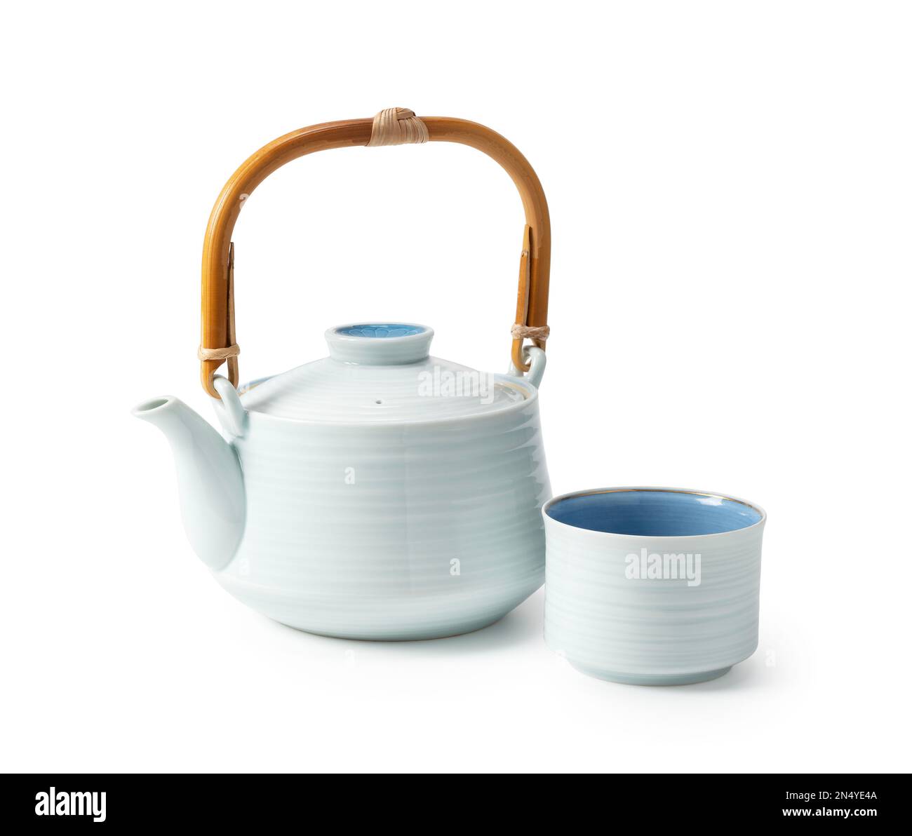 Japanese teacups and teapots placed against a white background