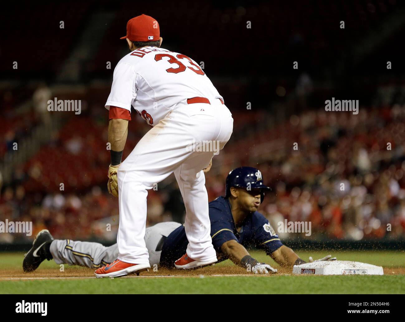 Milwaukee Brewers third baseman Daniel Robertson throws to first base to  put out Colorado Rockies' Austin Gomber during the second inning of a  baseball game Saturday, June 19, 2021, in Denver. (AP