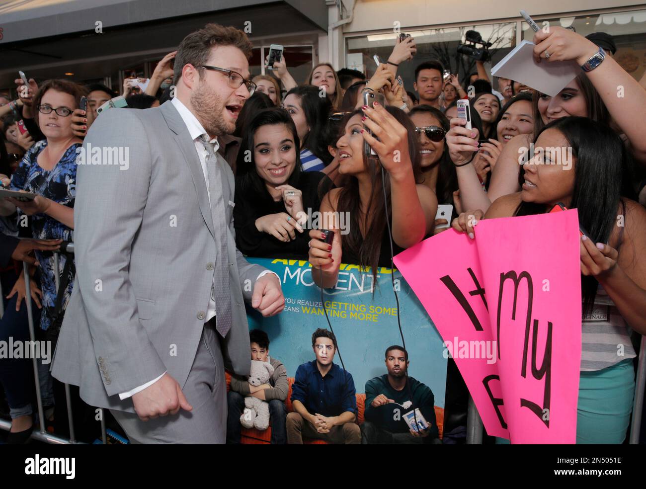 Seth Rogen takes a photo with fans as he arrives at the world premiere ...