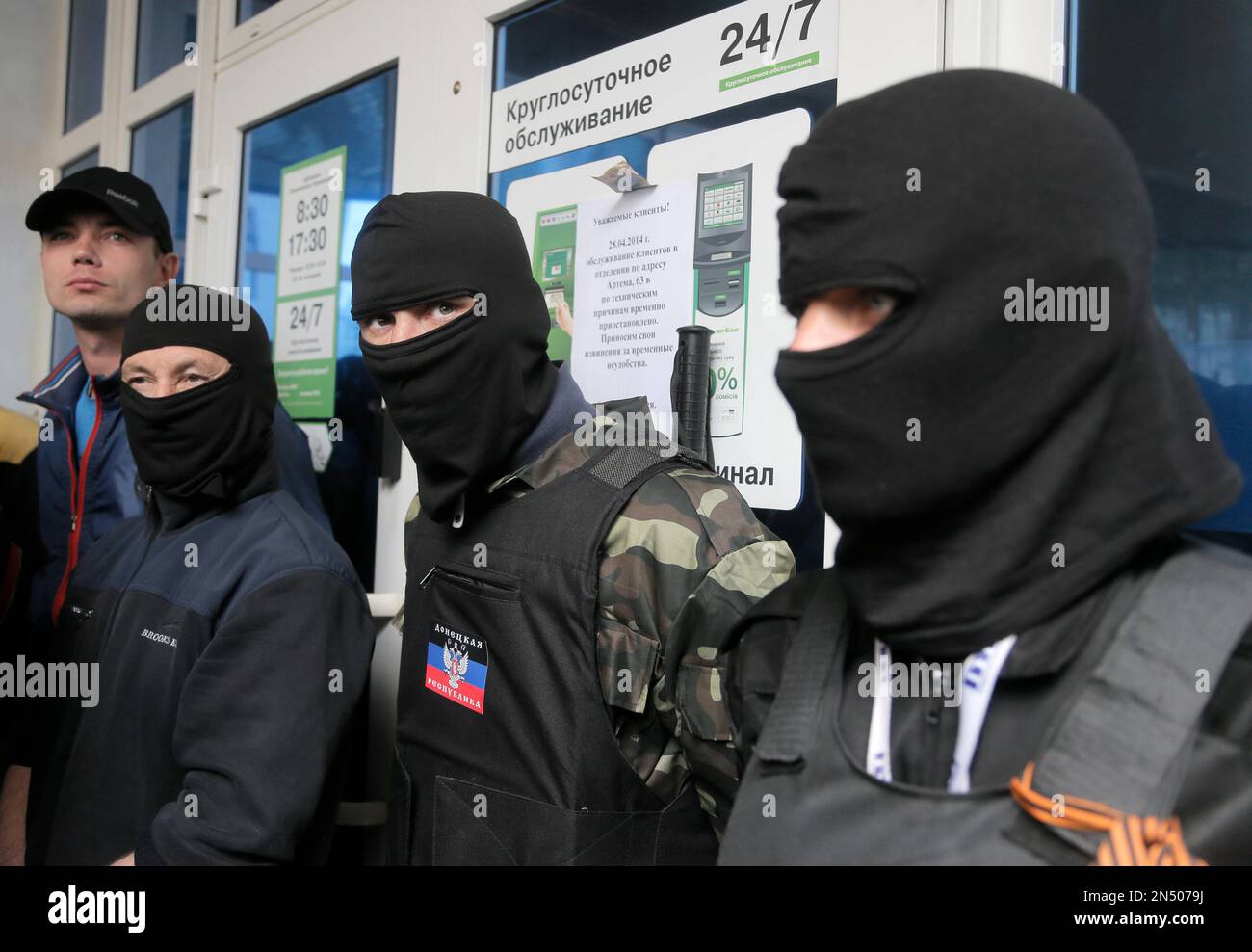 April 28, 2014 - Donetsk, Ukraine: Pro-Russia militants attack Ukrainians  who demonstrated peacefully for the preservation of the unity of their  country. The pro-Russian separatist group, mostly youths in balaclava, then  celebrated