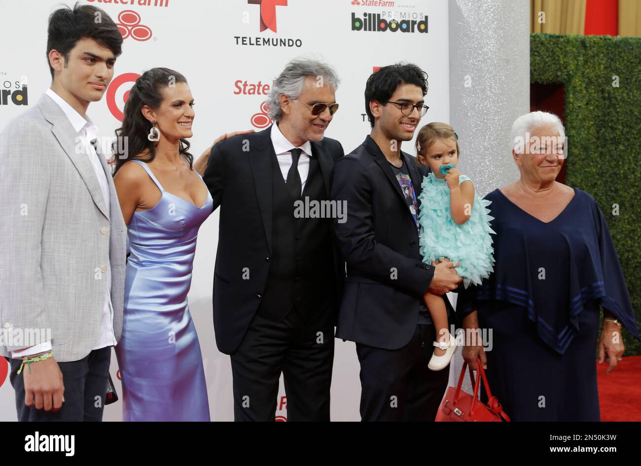 Singer Andrea Bocelli, third from left, his wife Veronica Berti, sons Amos  Bocelli, left, Matteo Botecci, third from right, daughter Virginia Bocelli  and his mother Edi Bocelli, right, arrive at the Latin