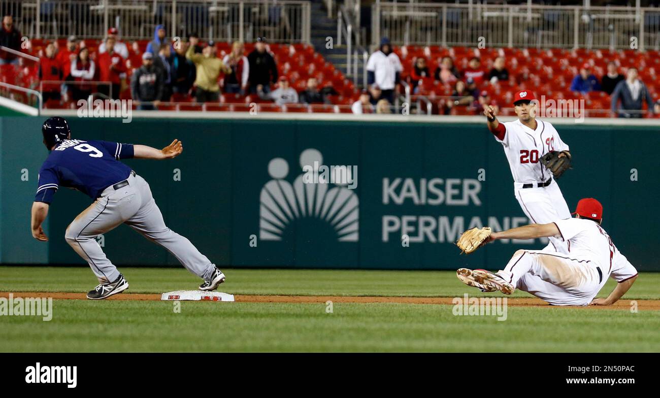 Washington Nationals' Anthony Rendon can't catch a ball hit by St