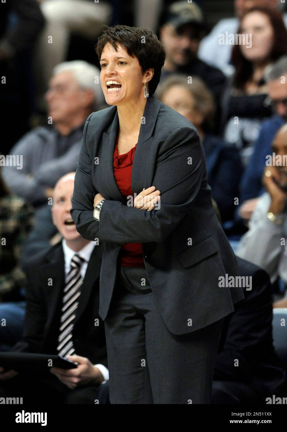 In this Nov. 22, 2013, photo, Boston University women's basketball coach  Kelly Greenberg calls out during a game against Connecticut in Hartford,  Conn. Greenberg resigned Wednesday, April 23, 2014, about a month