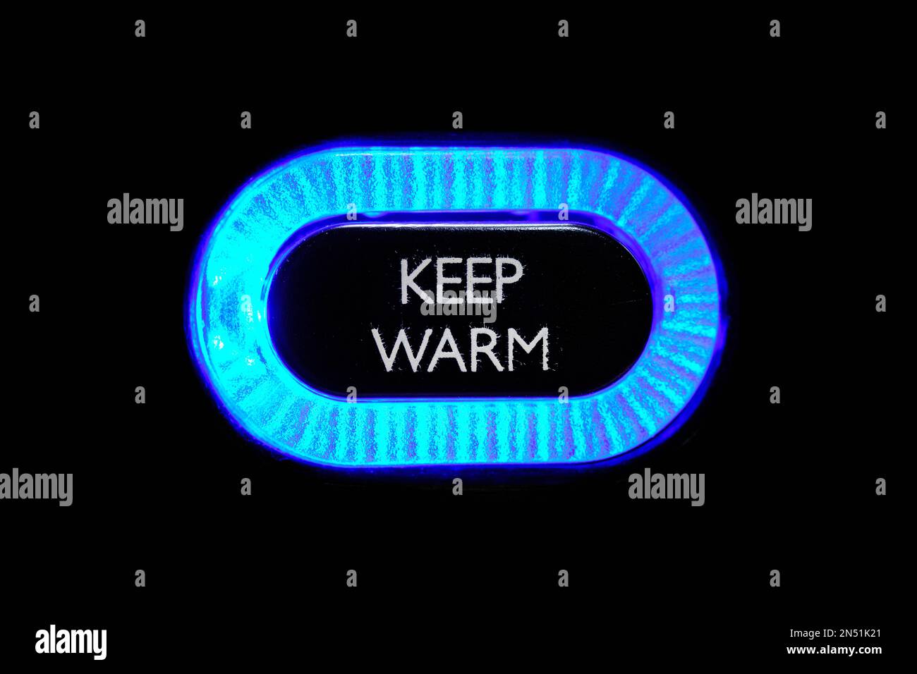 Lit 'keep warm' function button or information sign Stock Photo
