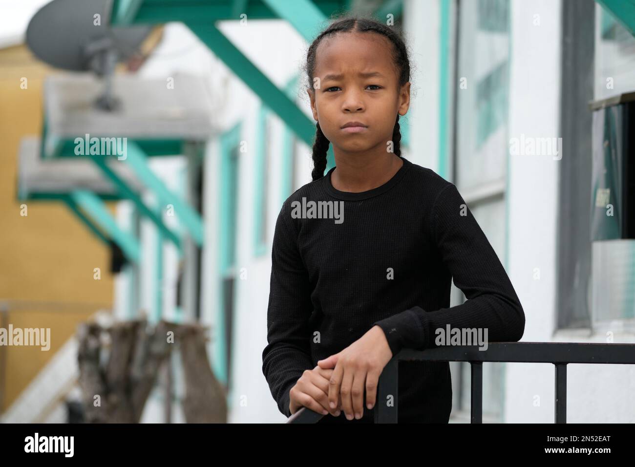 Ezekiel West, 10, stands for a portrait outside his home in Los