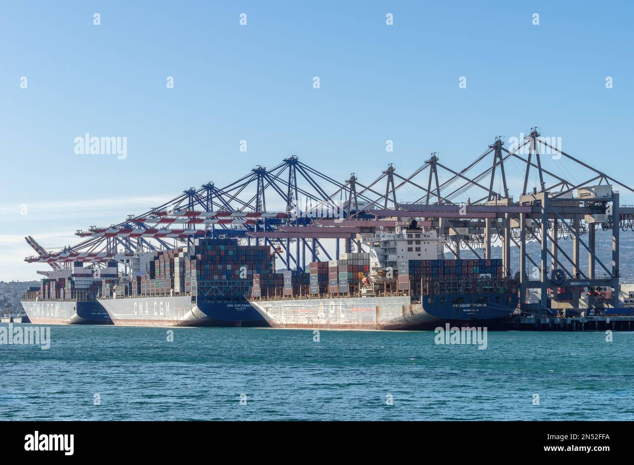 Container ships shown docked at Fenix Marine Services at the Port of Los Angeles in California. Stock Photo