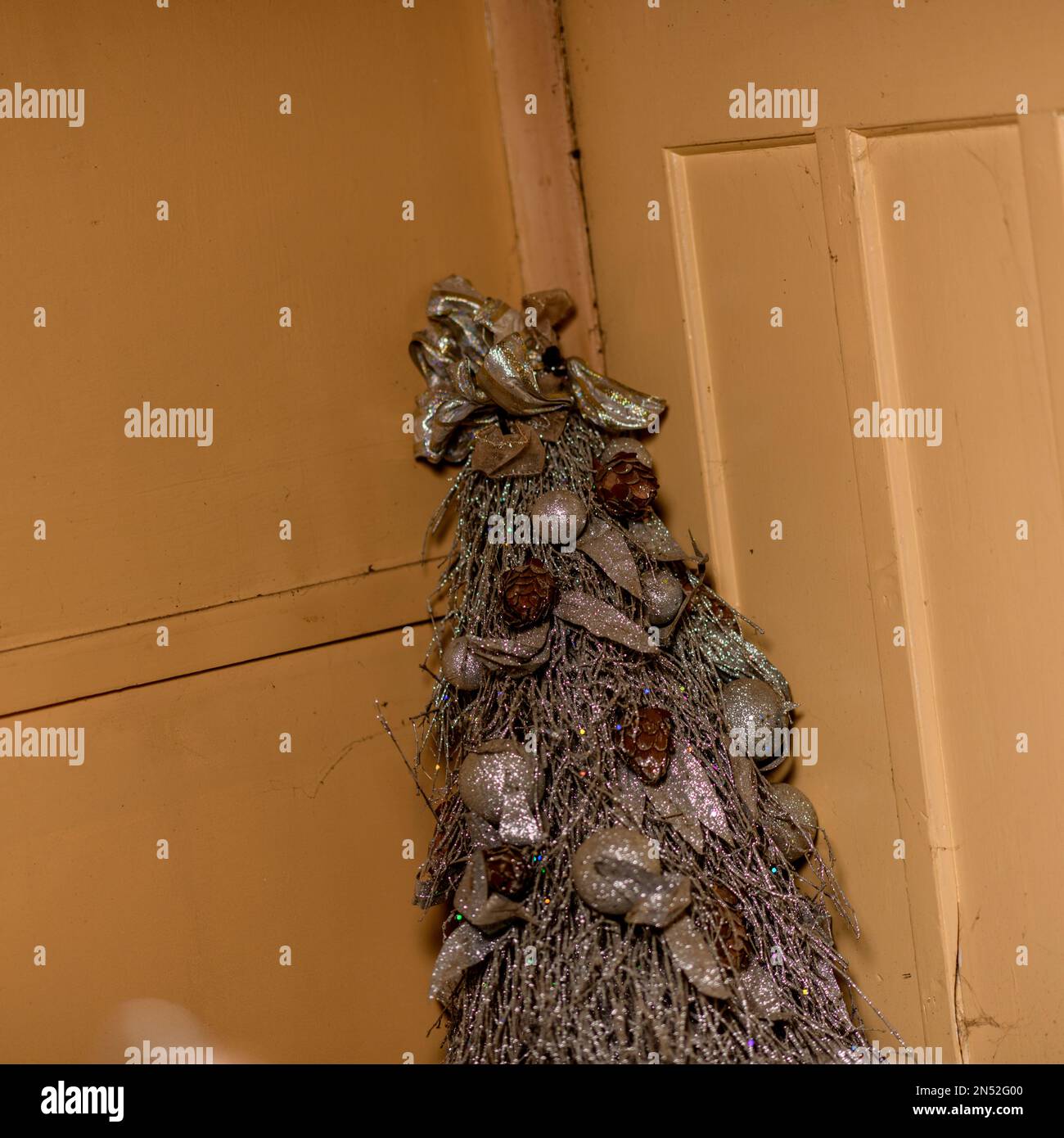 Christmas tree with decorations and surgical mask. Covid 19 pandemic.  Geneva. Switzerland Stock Photo - Alamy