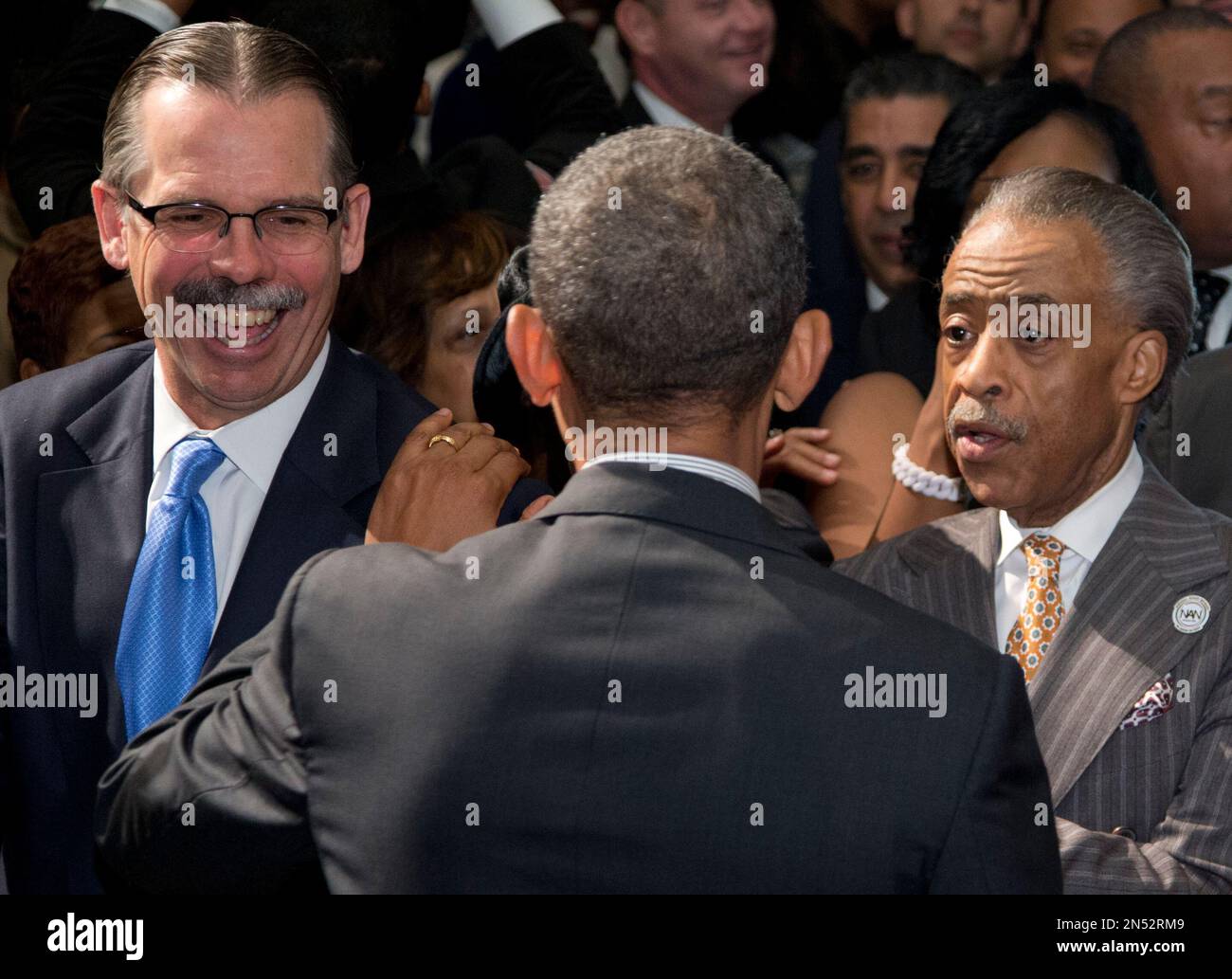 President Barack Obama greets Glenn Hutchins, co-founder of private