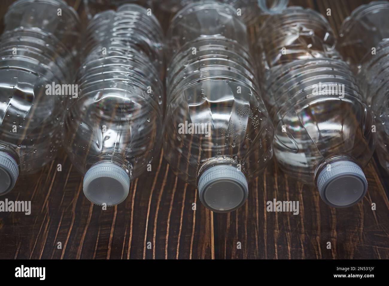 Empty plastic water bottles recycle material reduce waste wood