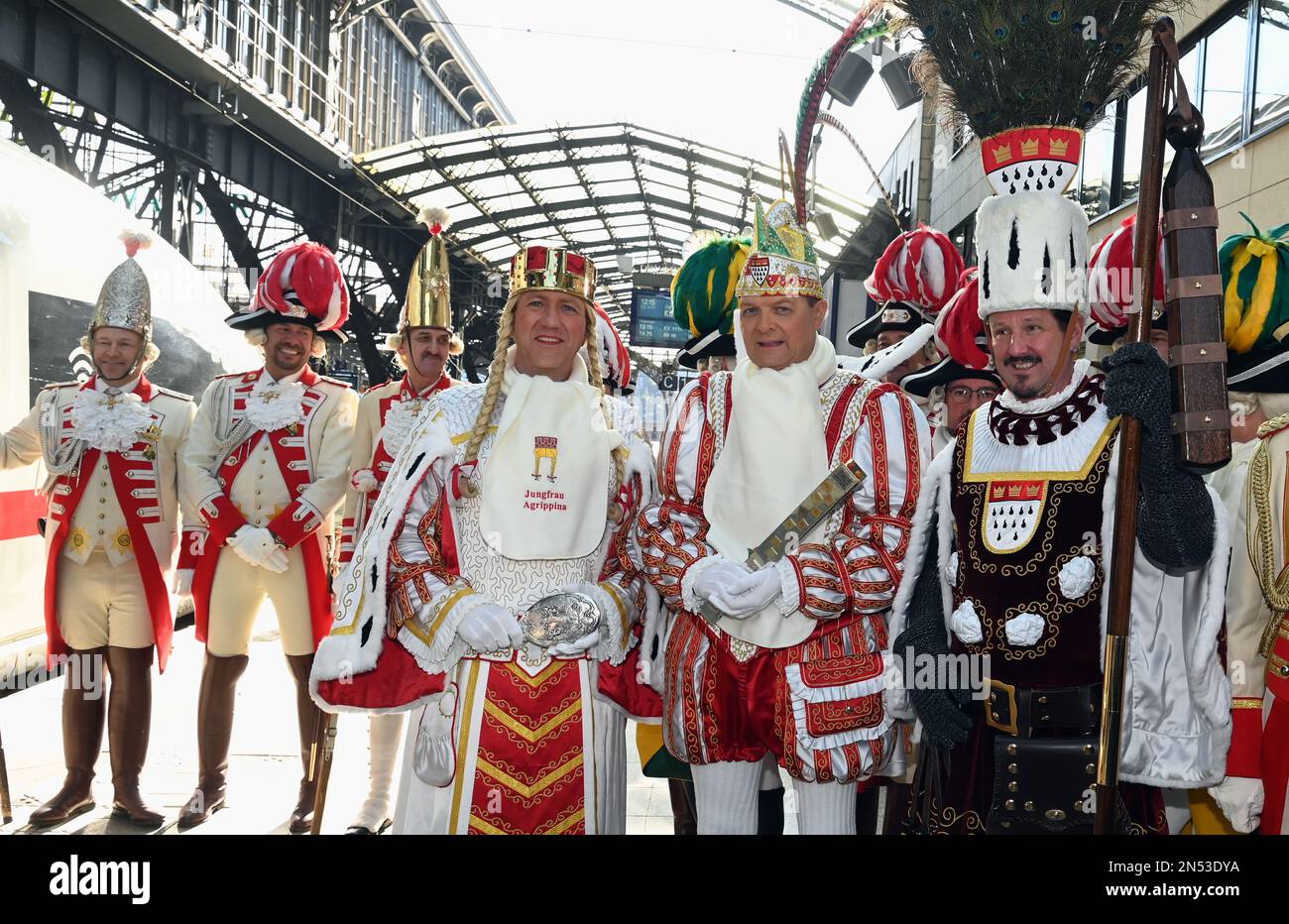 Cologne, Germany. 08th Feb, 2023. The Cologne Carnival triumvirate Maiden Agrippina (Andre Fahnenbruck), Prince Boris I (Boris Müller) and Peasant Marco (Marco Schneefeld, l-r, stand on the platform at the christening of the first ICE 3 Neo with the name 'Rhineland' in time for 200 years of Cologne Carnival Credit: Horst Galuschka/dpa/Alamy Live News Stock Photo