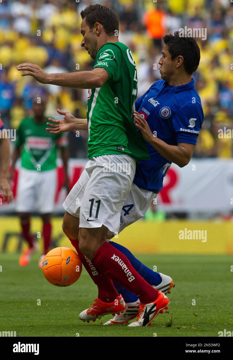 America's Luis Gabriel Rey, fights for the ball with Cruz Azul's Julio Cesar  Dominguez during a Mexican soccer league match in Mexico City, Saturday,  April 5, 2014. (AP Photo/Christian Palma Stock Photo -, image size:903x1390