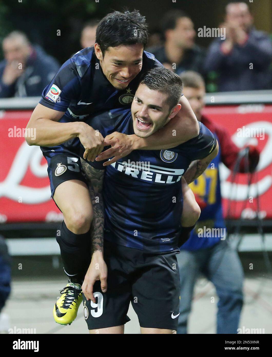 Inter Milan forward Mauro Icardi, right, of Argentina, celebrates with his  teammate defender Yuto Nagatomo, of Japan, after scoring during the Serie A  soccer match between Inter Milan and Bologna at the