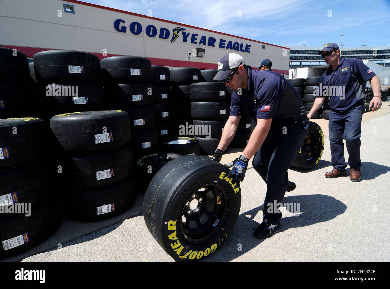 Brayden Wienke stacks Goodyear tires for use by NASCAR in auto racing