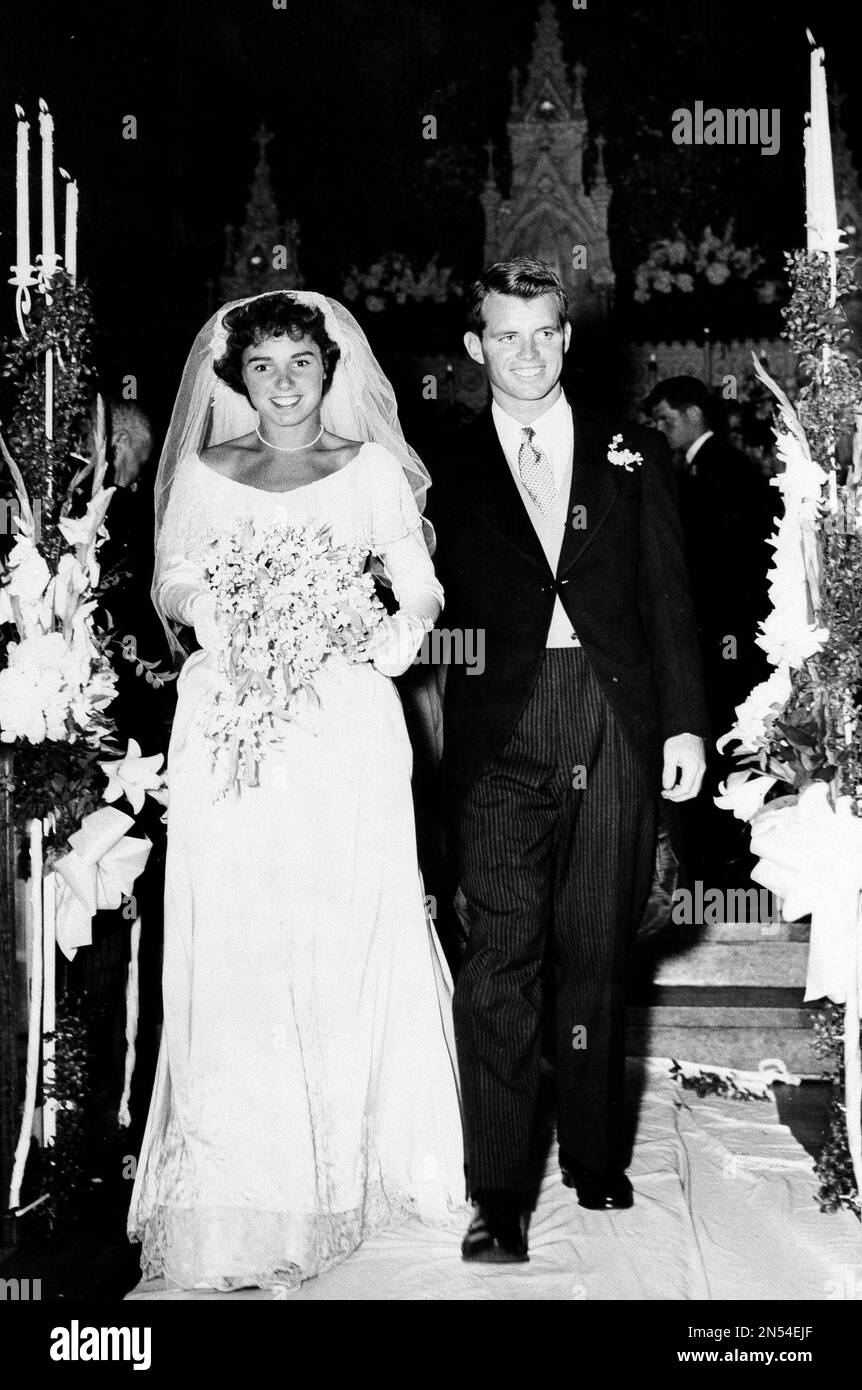Robert F. Kennedy and his bride, Ethel Skakel, are shown walking down 