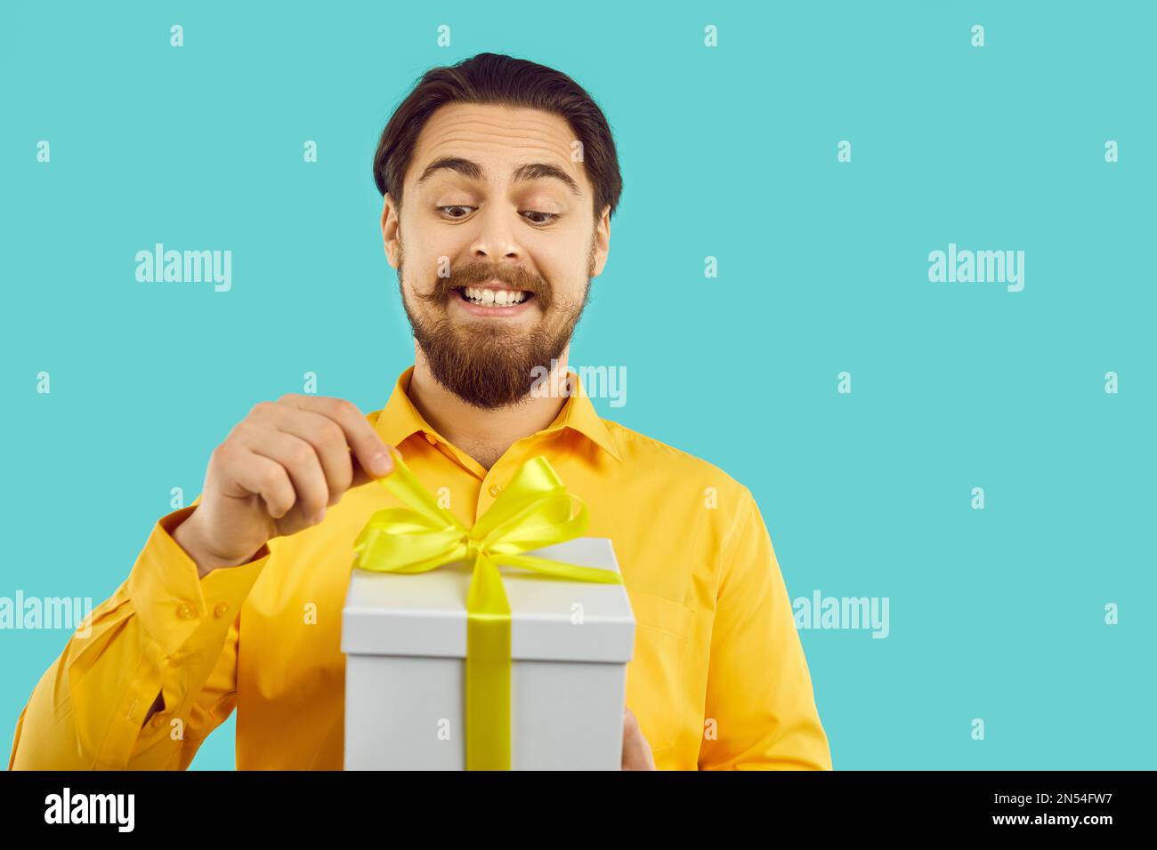 Funny man open gift box with present Stock Photo
