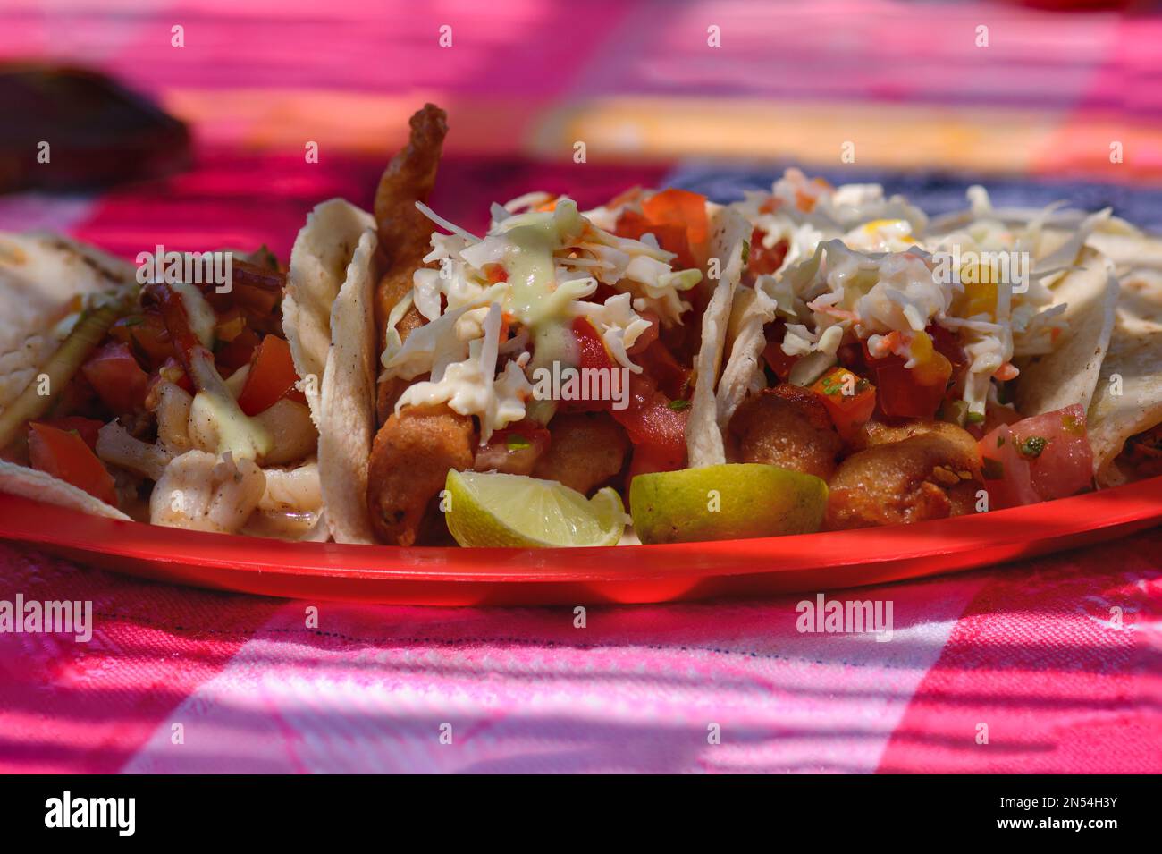 Mexican Baja fish tacos in Todos Santos with fresh sauce on colorful