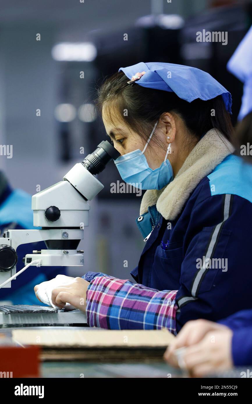 SUQIAN, CHINA - FEBRUARY 9, 2023 - Workers make inductive components for export at the production workshop of Qingbang Electronic Components (Sihong) Stock Photo