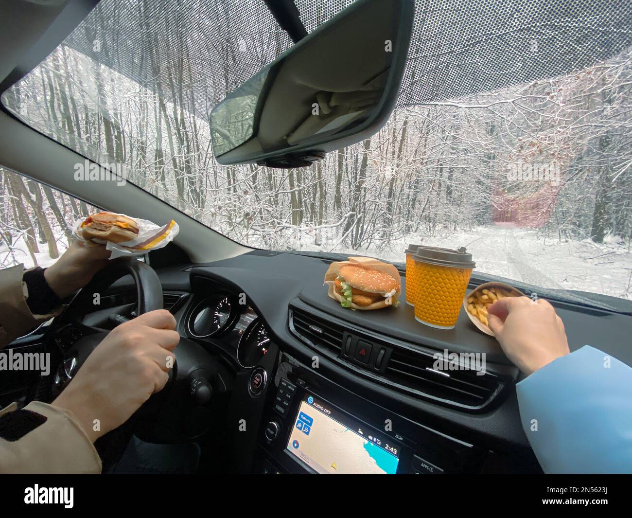 A man's got a burger, a woman's got fries, they stopped for lunch Stock ...