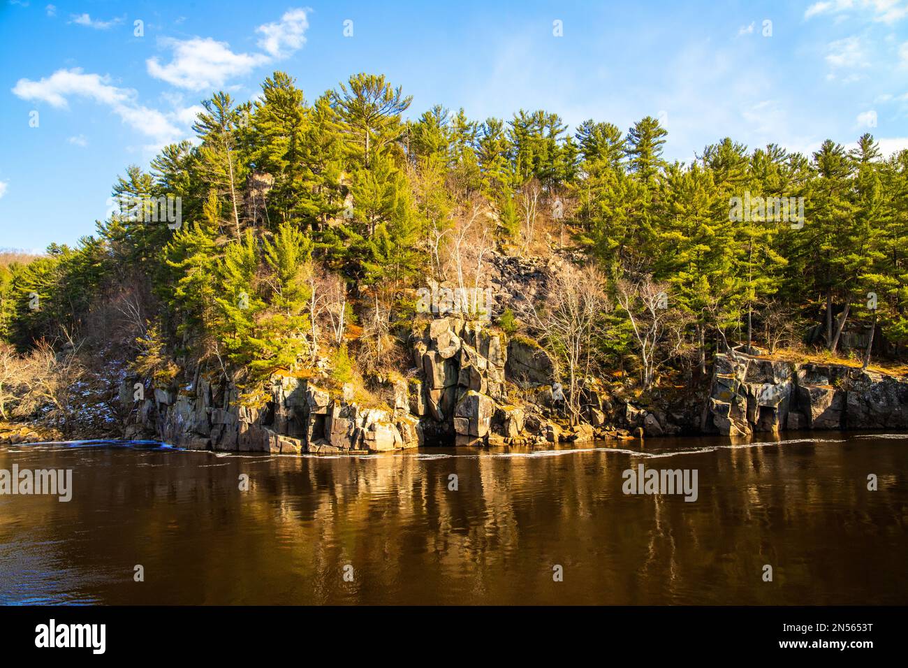 Beautiful Dalles of the St. Croix River and Interstate State Park with rugged cliffs and pine trees in Taylors Falls, Minn. and St. Croix Falls, Wis. Stock Photo