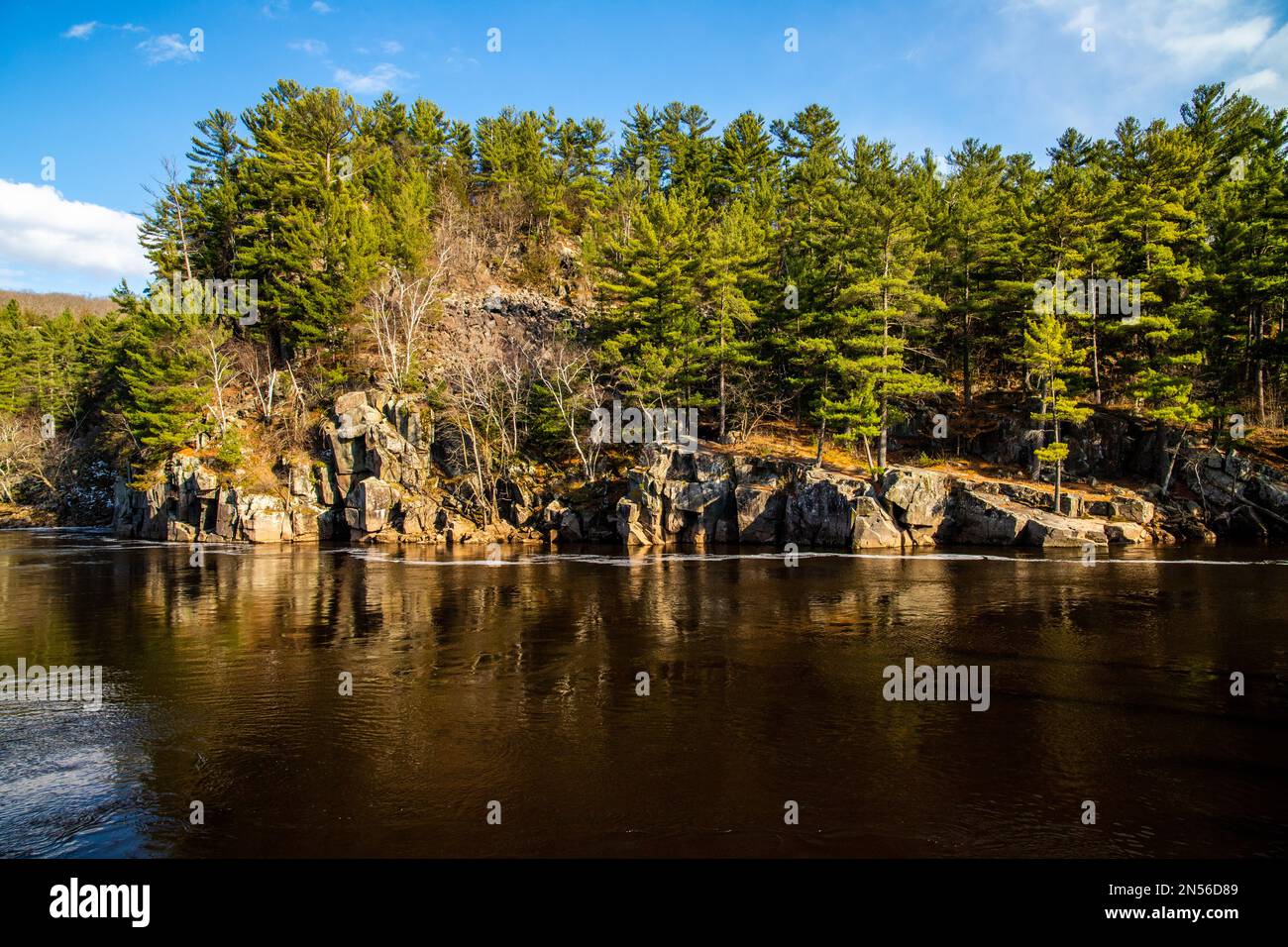 Beautiful Dalles of the St. Croix River and Interstate State Park with rugged cliffs and pine trees in Taylors Falls, Minn. and St. Croix Falls, Wis. Stock Photo