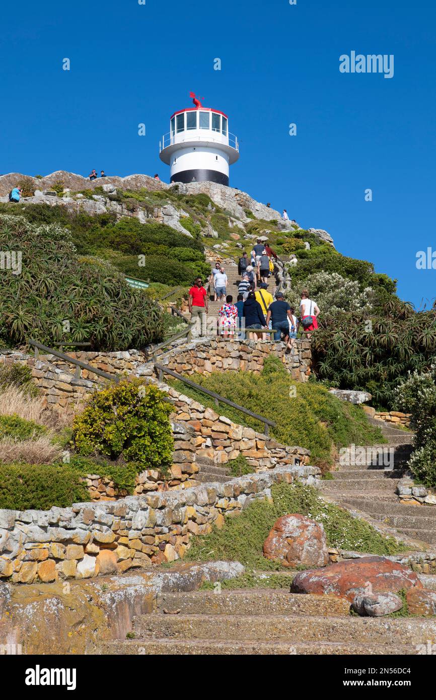 Tourists at the vantage point with lighthouse, Cape Point, Cape of Good Hope, Table Mountain National Park, Cape Peninsula, Western Cape, South Africa Stock Photo