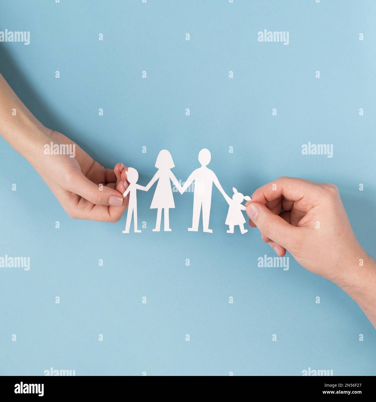top view people holding hands cute paper family. Resolution and high quality beautiful photo Stock Photo