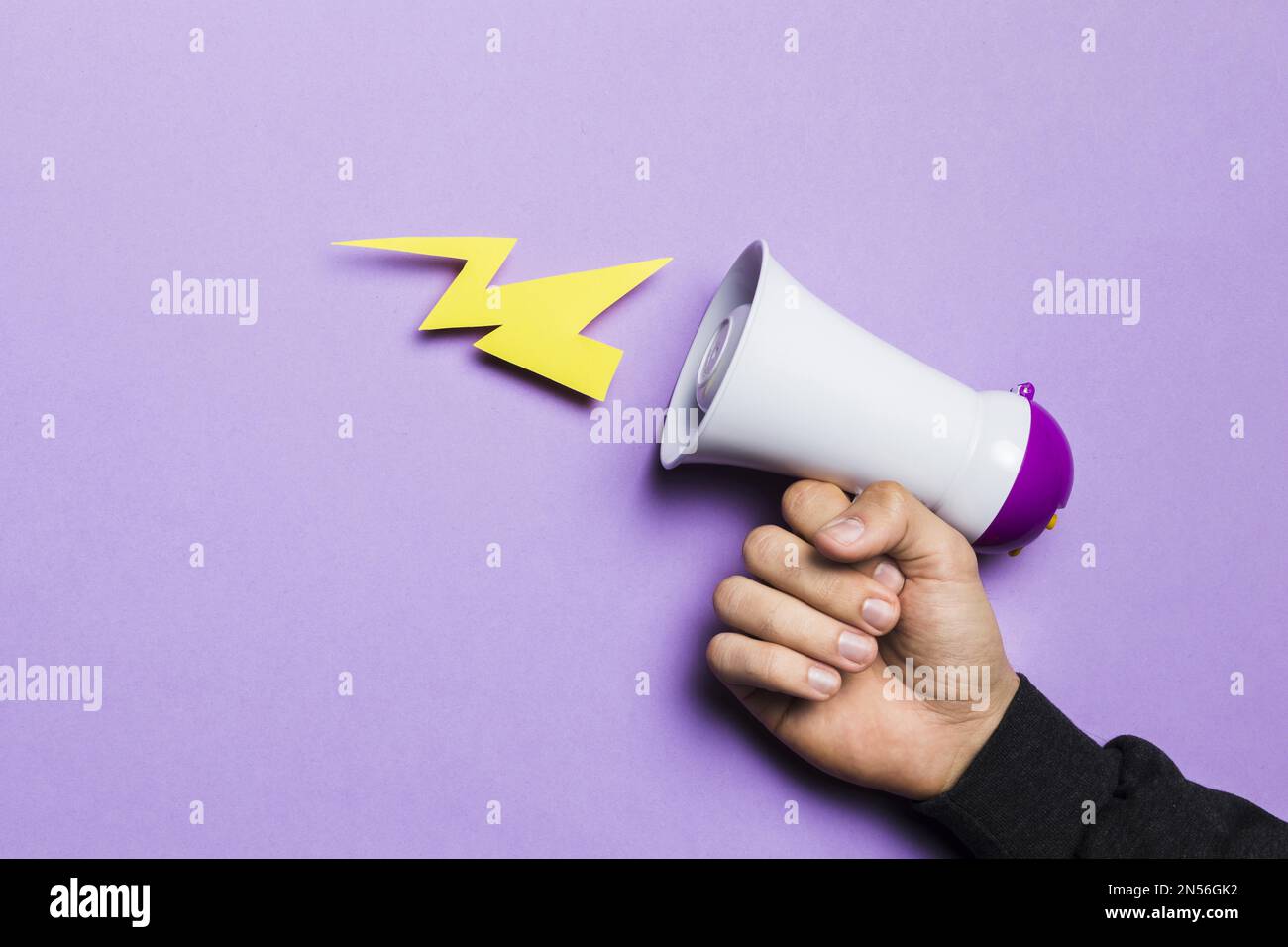 woman s hand showing power thunder with megaphone. Resolution and high quality beautiful photo Stock Photo