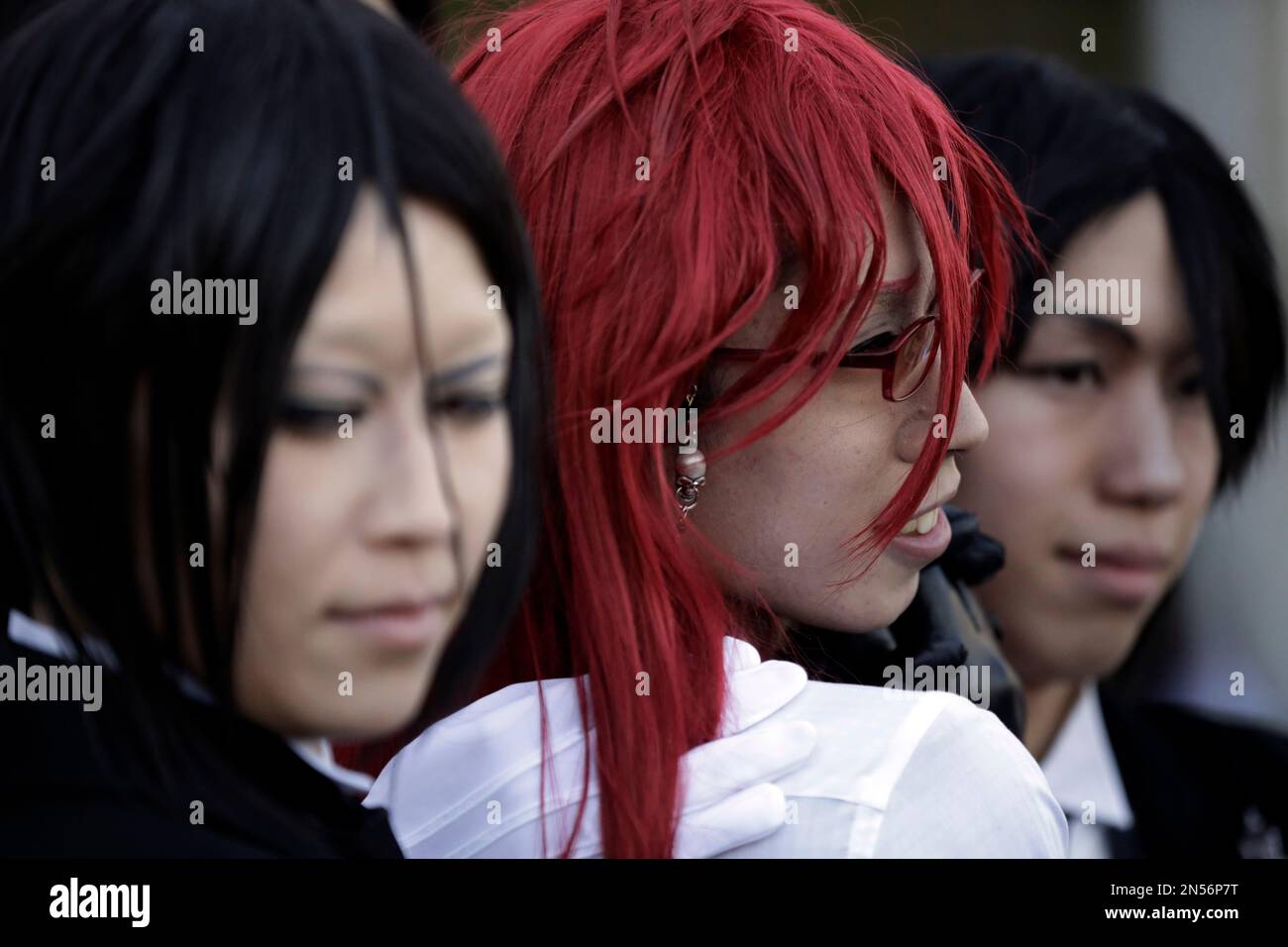 Costume players, or cosplayers, pose for anime fans during AnimeJapan ...