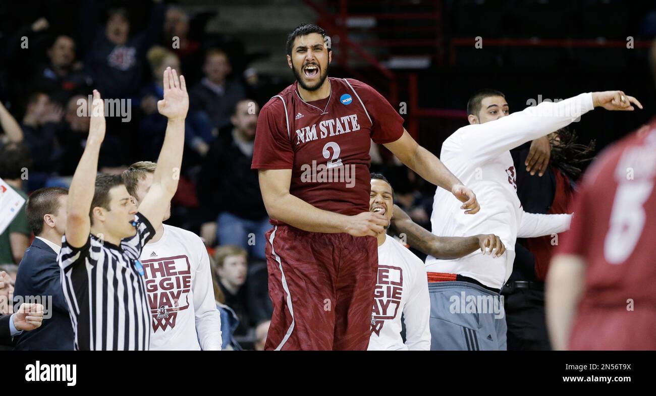 New Mexico State's Sim Bhullar yells from the bench against San Diego