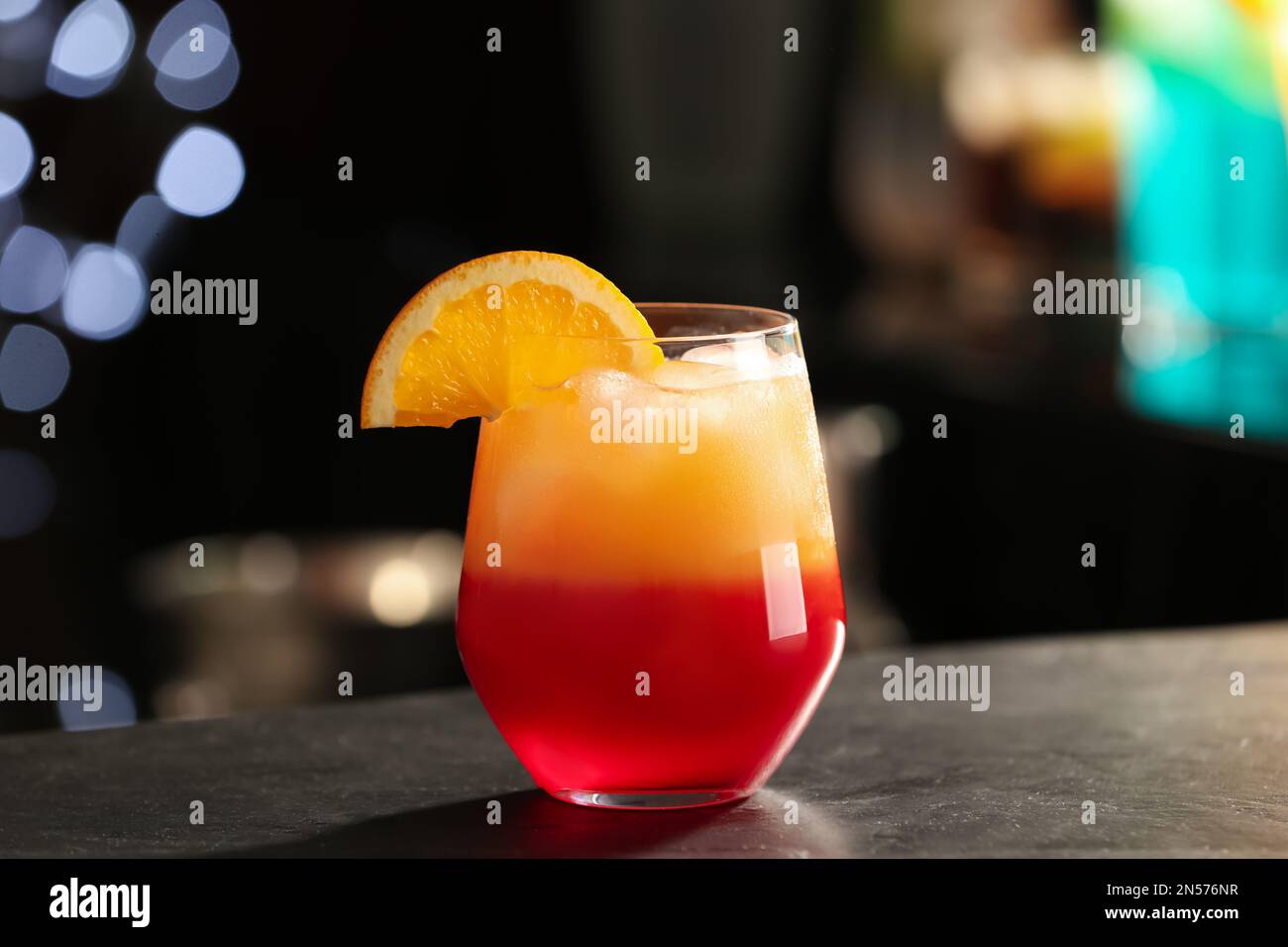Delicious cocktail with orange on bar counter Stock Photo