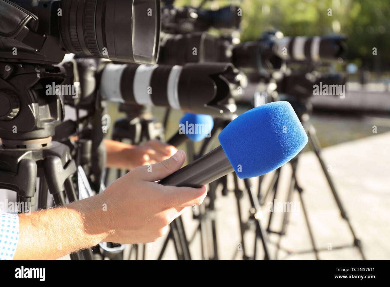 Journalists with microphones and video cameras outdoors, closeup Stock Photo